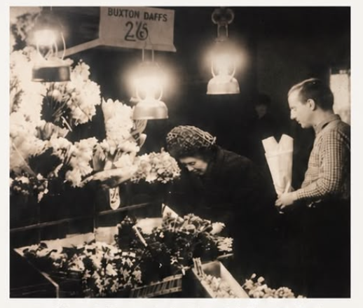 Family archive photograph of David’s father selling flowers at the stall in the 1960s